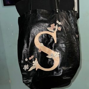 Leather bag with letter S, cute design